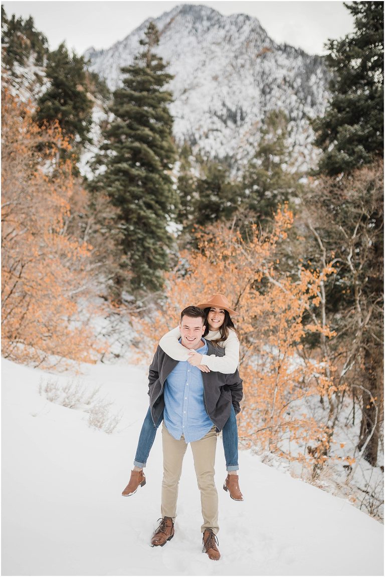 engaged couple in the snow